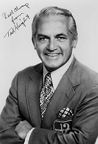 Publicity photograph of Ted Knight in a suit with a WJM-TV Channel 12 pocket patch, inscribed "Best Always from Ted Knight".